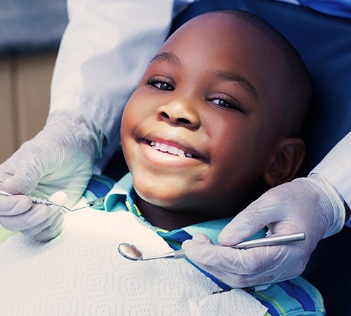 Child receiving dental checkup