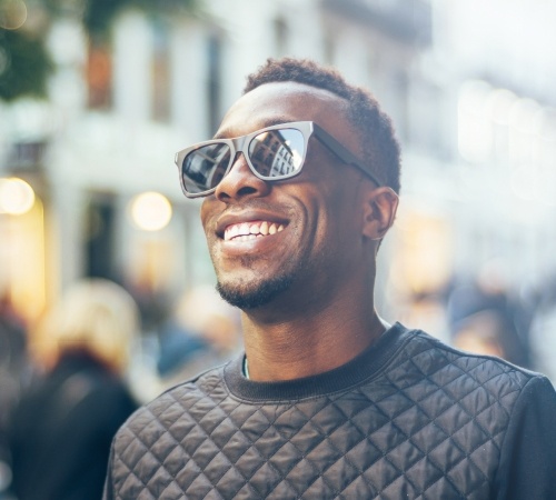 Man's flawless smile thanks to metal-free dental restorations