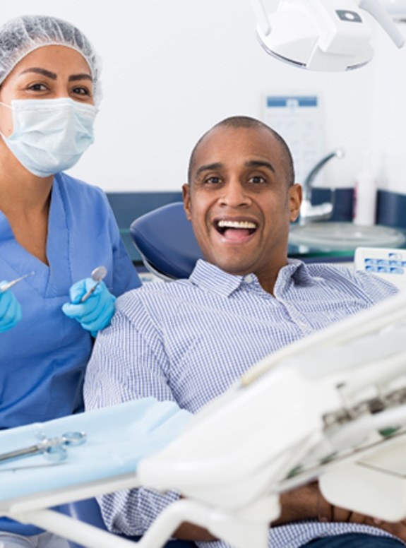 Happy dental patient visiting Delta Dental dentist in Houston