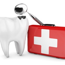 Tooth next to red first aid kit on white background