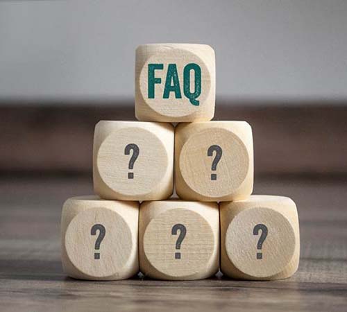 Stack of dice showing question marks and the term “FAQ”