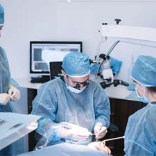 group of dentists performing dental implant surgery 
