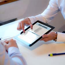 two people looking at dental insurance information on a tablet