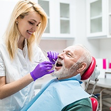 Older man visiting emergency dental office in Houston for checkup
